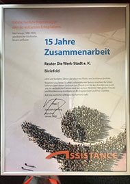 Urkunde der Assistence Group für 15 Jahre Partnerschaft